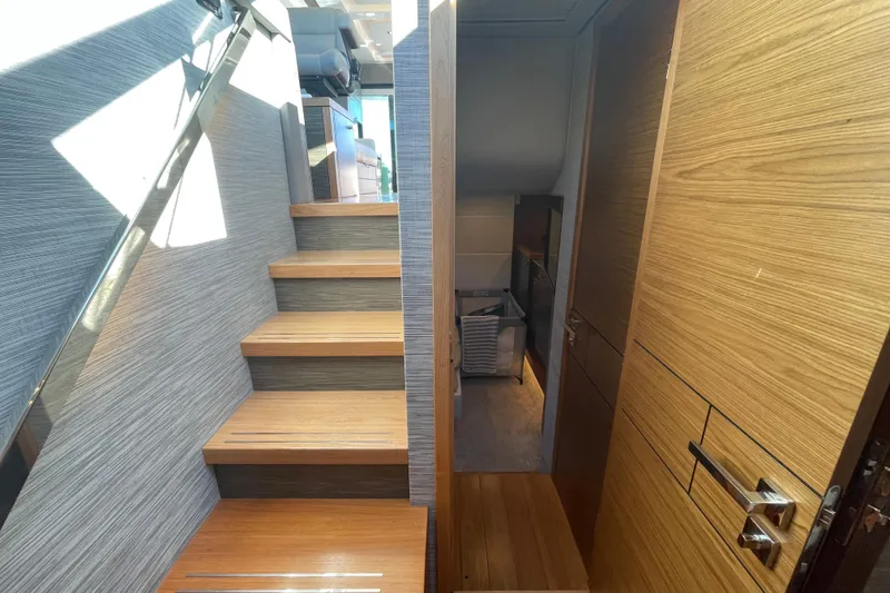 Slide: The Image of Interior view of 2020 Tiara 53C yacht with wooden stairs and modern design. - 31