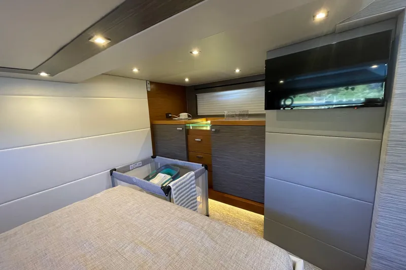 Slide: The Image of Luxurious interior of a 2020 Tiara 53C yacht with modern furnishings and ambient lighting. - 34