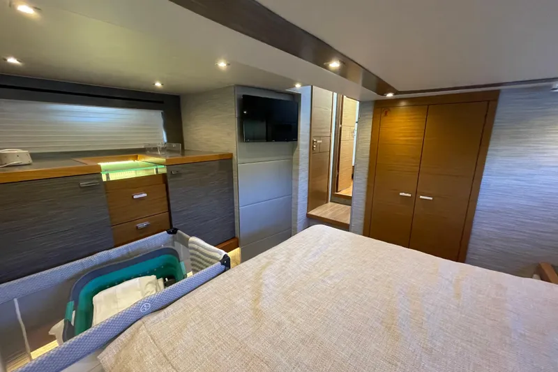 Slide: The Image of Luxurious interior of 2020 Tiara 53C yacht with modern furnishings and ambient lighting. - 36