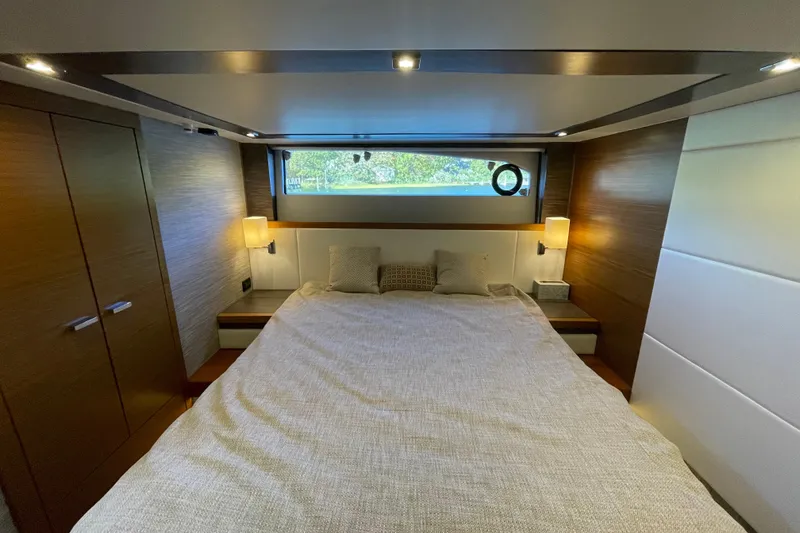 Slide: The Image of Luxurious bedroom interior of 2020 Tiara 53C yacht with modern design and ambient lighting. - 38