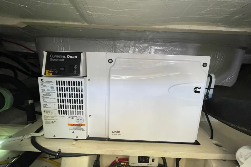 Slide: The Image of Cummins Onan generator in a 2020 Tiara 53C yacht engine room. - 43