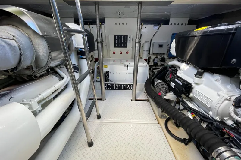 Slide: The Image of Engine room of a 2020 Tiara 53C yacht, featuring Volvo Penta engines. - 44