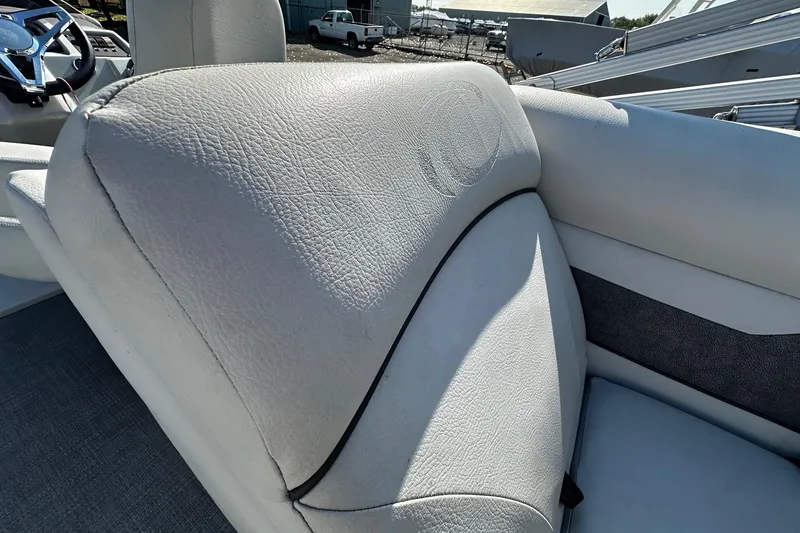 Slide: The Image of 2021 Crest Classic LX 220 SLC boat seat with textured white upholstery. - 7