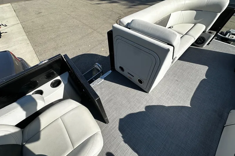 Slide: The Image of 2021 Crest Classic LX 220 SLC boat interior with gray seating and flooring. - 8