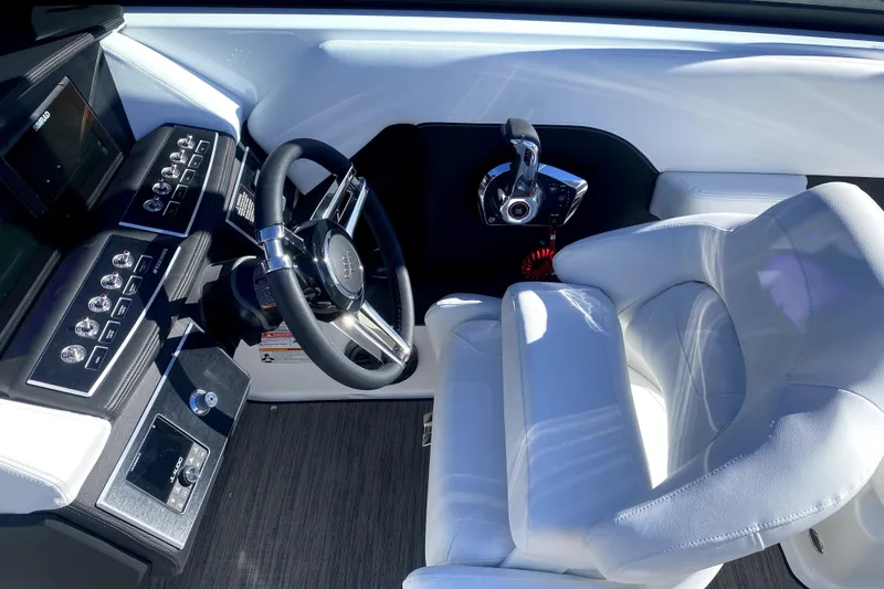 Slide: The Image of 2026 Four Winns H6 boat cockpit with modern steering and controls. - 13