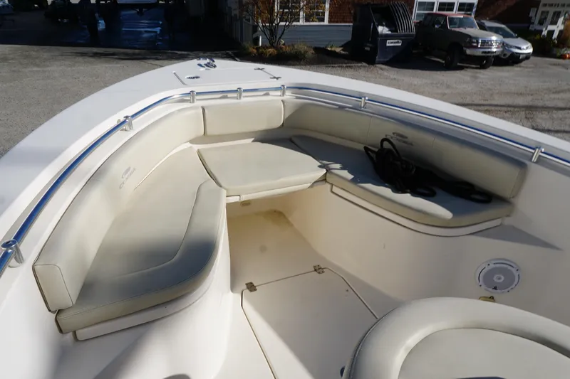 Slide: The Image of 2019 Cobia 237 Center Console boat with spacious seating and storage area. - 16
