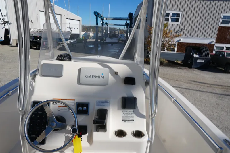 Slide: The Image of 2019 Cobia 237 Center Console boat dashboard with Garmin navigation system. - 25
