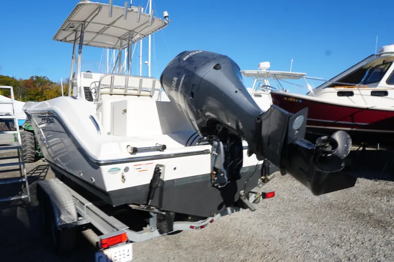 Slide: The Image of 2019 Cobia 237 Center Console boat on trailer with outboard motor. - 6