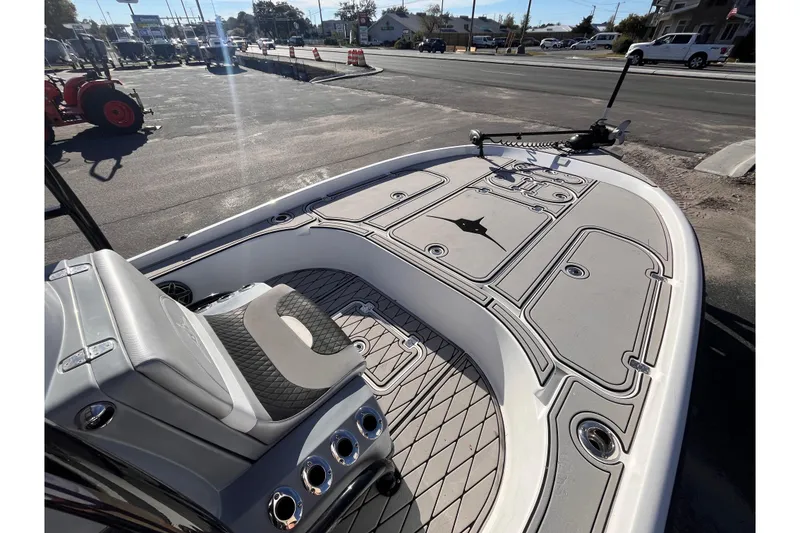 Slide: The Image of 2020 Turner Boatworks 2410 VS deck view with seating and storage compartments. - 12
