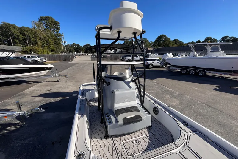 Slide: The Image of 2020 Turner Boatworks 2410 VS in a marina, showcasing sleek design and modern features. - 13