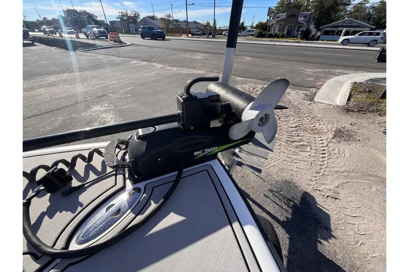 Slide: The Image of 2020 Turner Boatworks 2410 VS with trolling motor on a sunny day, parked roadside. - 14