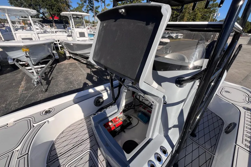 Slide: The Image of 2020 Turner Boatworks 2410 VS with open console, showcasing interior components and sleek design. - 16