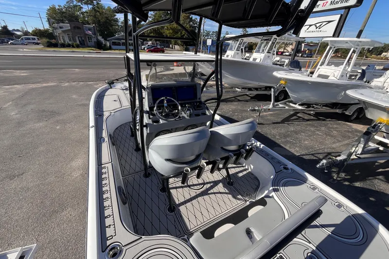 Slide: The Image of 2020 Turner Boatworks 2410 VS with dual seats and modern dashboard, parked outdoors. - 19