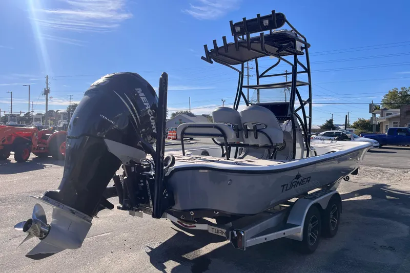 Slide: The Image of 2020 Turner Boatworks 2410 VS with Mercury Verado engine, parked on a trailer. - 5
