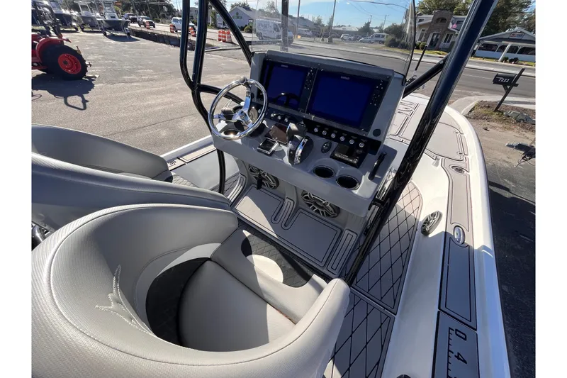 Slide: The Image of 2020 Turner Boatworks 2410 VS interior with dual screens and steering wheel. - 8