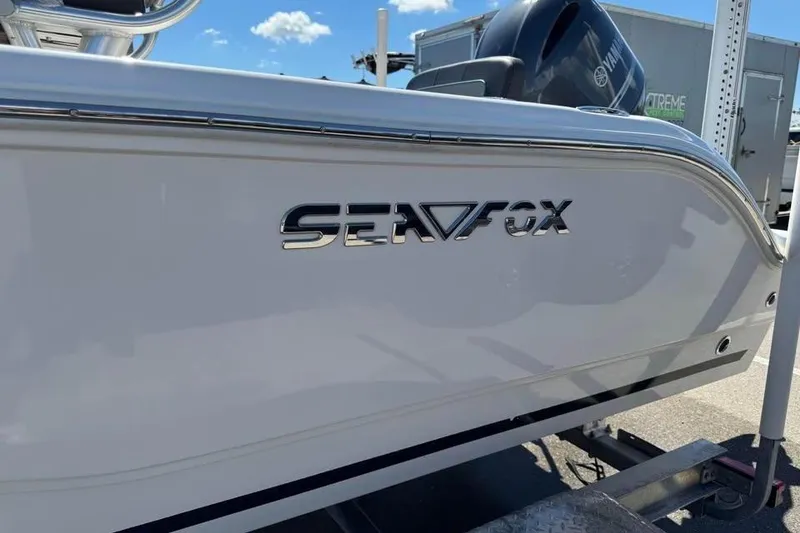 Slide: The Image of 2018 Sea Fox 206 Commander boat side view with logo, on trailer. - 10