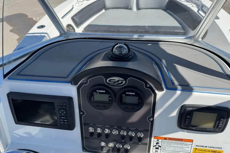 Slide: The Image of 2018 Sea Fox 206 Commander dashboard with Yamaha gauges and navigation instruments. - 12