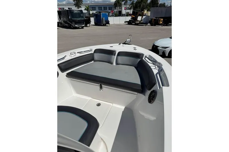 Slide: The Image of 2018 Sea Fox 206 Commander boat interior with cushioned seating and storage. - 18