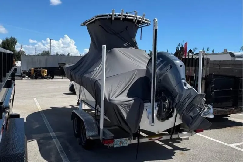 Slide: The Image of 2018 Sea Fox 206 Commander boat covered on trailer with Yamaha outboard motor. - 2