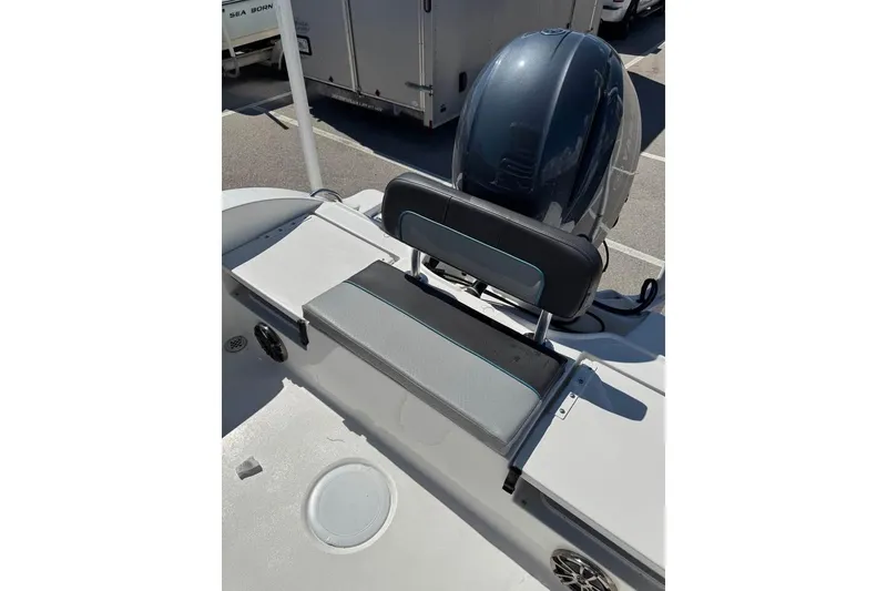 Slide: The Image of 2018 Sea Fox 206 Commander boat with cushioned seating and outboard motor. - 7