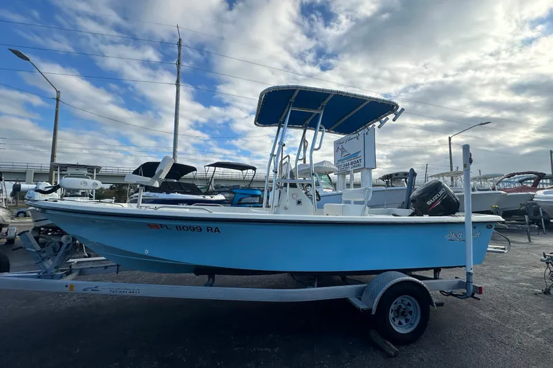 The Image of 2016 Stott Craft SCV202 boat on trailer under cloudy sky. - 0