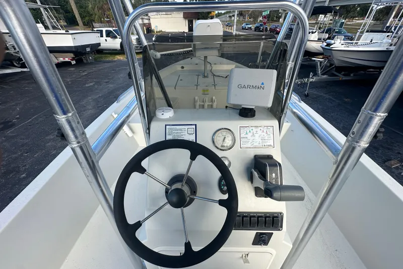 Slide: The Image of 2016 Stott Craft SCV202 boat console with Garmin navigation system and steering wheel. - 13