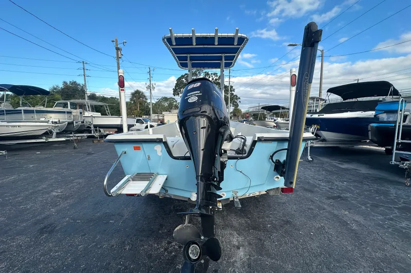 Slide: The Image of 2016 Stott Craft SCV202 boat with outboard motor in a marina setting. - 3