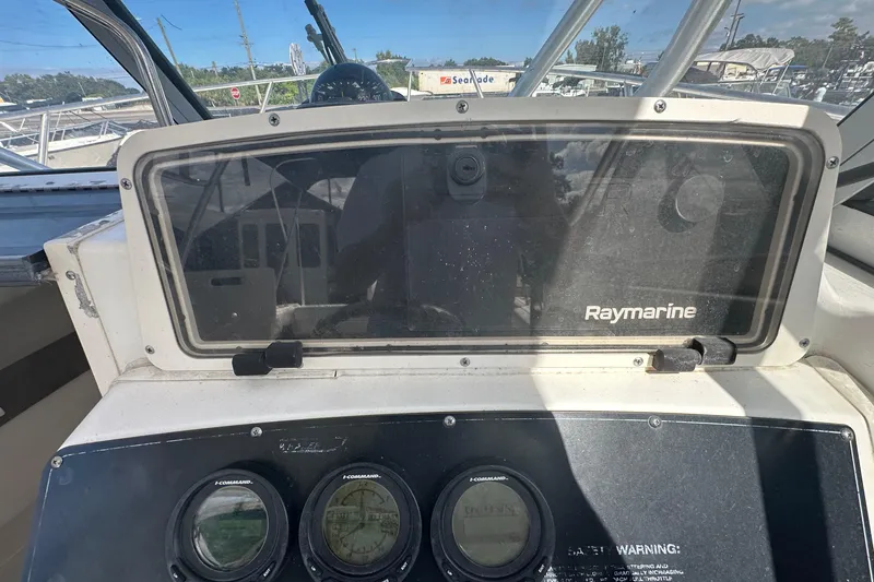 Slide: The Image of Dashboard of a 2001 Boston Whaler 23 Conquest with Raymarine navigation system. - 37