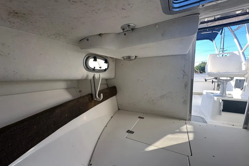 Slide: The Image of Interior view of a 2001 Boston Whaler 23 Conquest boat cabin. - 53