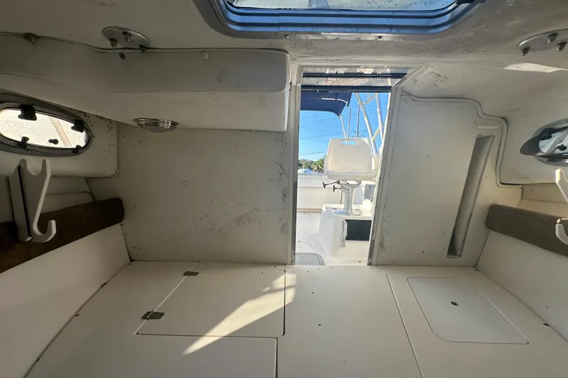 Slide: The Image of Interior view of a 2001 Boston Whaler 23 Conquest boat cabin. - 54