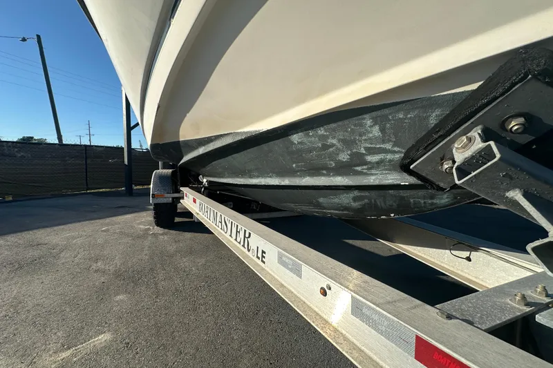 Slide: The Image of 2001 Boston Whaler 23 Conquest boat on a trailer, side view. - 6