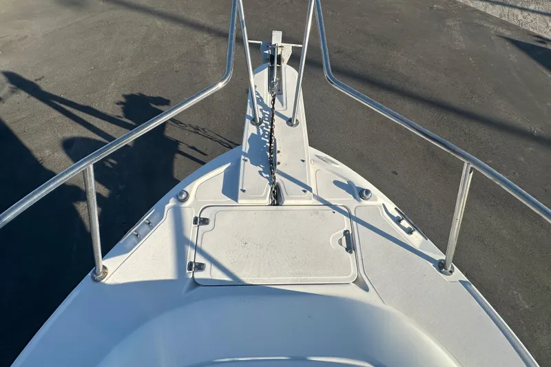 Slide: The Image of Bow view of 2001 Boston Whaler 23 Conquest boat with anchor and railings. - 64