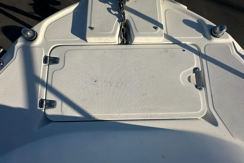 Slide: The Image of 2001 Boston Whaler 23 Conquest boat deck with storage hatch and anchor chain. - 65