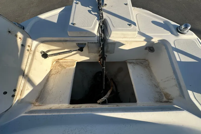Slide: The Image of 2001 Boston Whaler 23 Conquest anchor locker with chain and rope. - 66