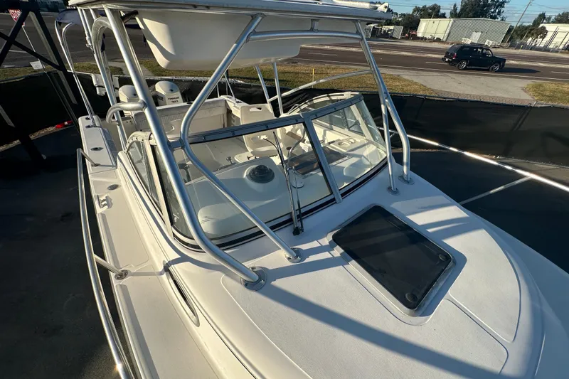 Slide: The Image of 2001 Boston Whaler 23 Conquest boat with sleek design and sturdy railings. - 72