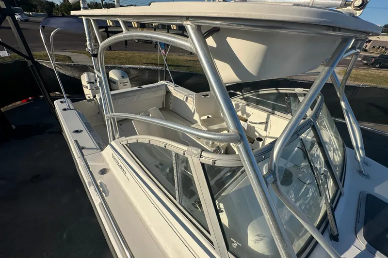Slide: The Image of 2001 Boston Whaler 23 Conquest boat with sturdy frame and spacious deck. - 73
