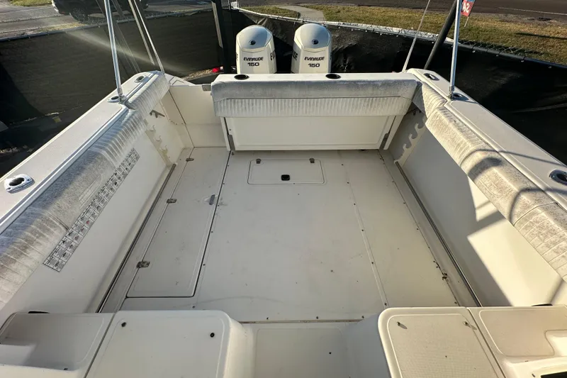 Slide: The Image of 2001 Boston Whaler 23 Conquest boat interior with Evinrude 150 engines, spacious deck. - 86