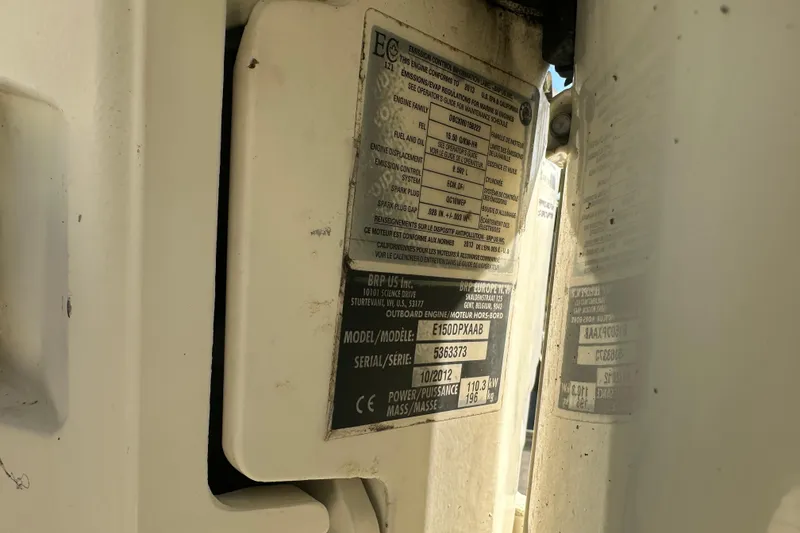 Slide: The Image of Label details on a 2001 Boston Whaler 23 Conquest boat engine. - 92