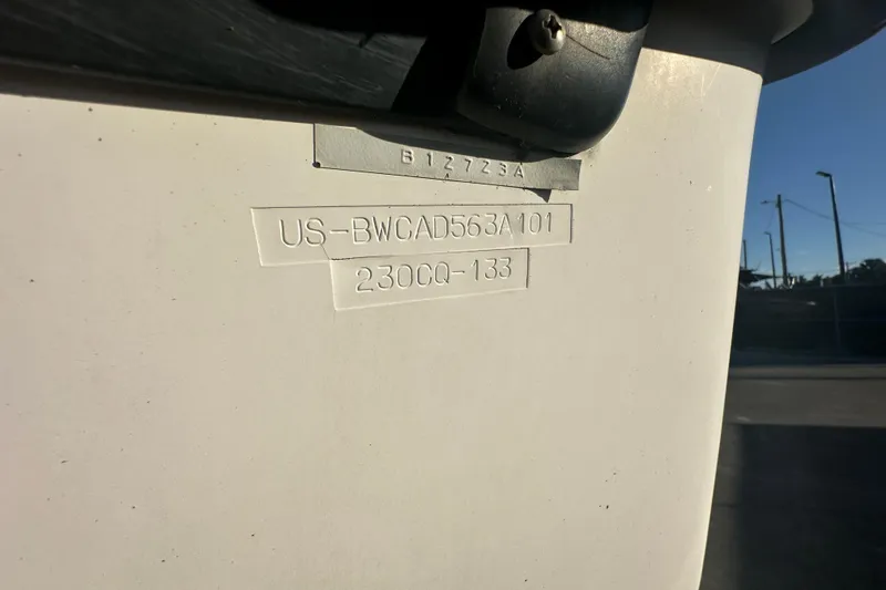 Slide: The Image of 2001 Boston Whaler 23 Conquest hull identification number on boat exterior. - 94