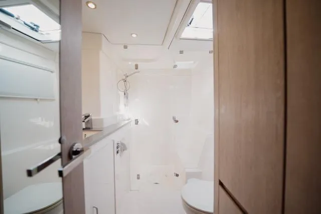 Slide: The Image of Luxurious bathroom interior of 2017 Leopard 51 Powercat yacht, featuring modern fixtures and skylights. - 101