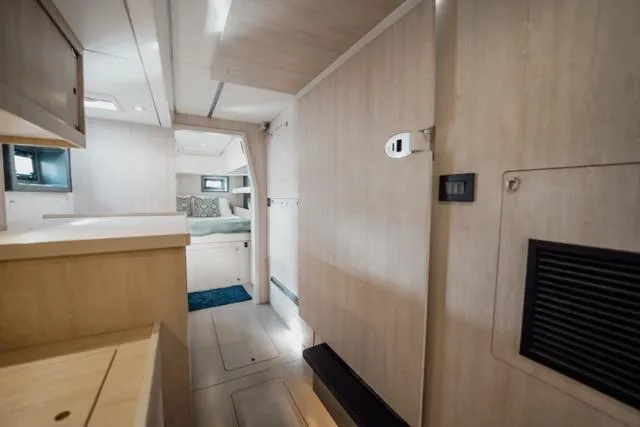 Slide: The Image of Interior of 2017 Leopard 51 Powercat, featuring modern design and cozy sleeping area. - 102