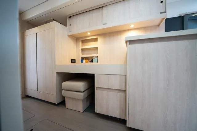 Slide: The Image of Interior of 2017 Leopard 51 Powercat yacht with modern wooden cabinetry and seating. - 106