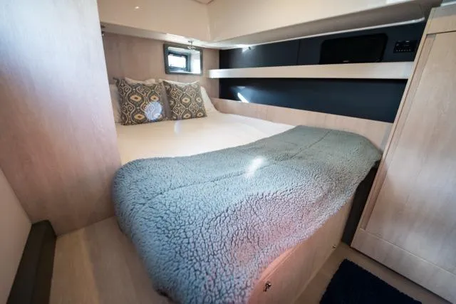Slide: The Image of Cozy bedroom in 2017 Leopard 51 Powercat with plush bedding and modern design. - 113
