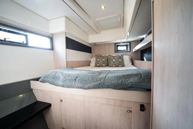 Slide: The Image of Luxurious bedroom interior of 2017 Leopard 51 Powercat yacht with cozy bedding. - 116
