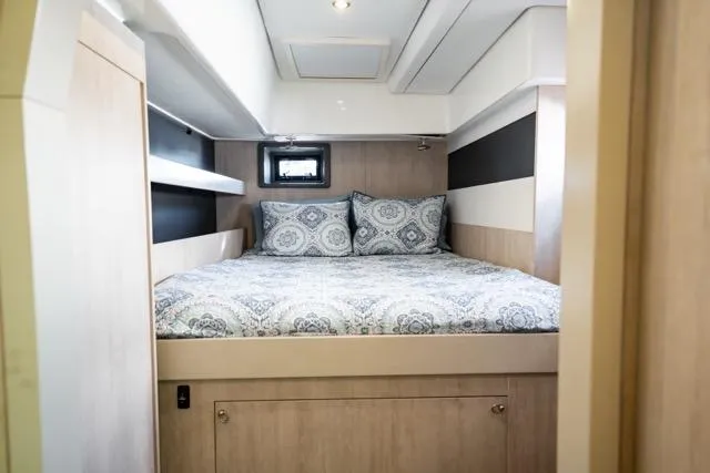 Slide: The Image of Bedroom interior of 2017 Leopard 51 Powercat with patterned bedding and modern design. - 122