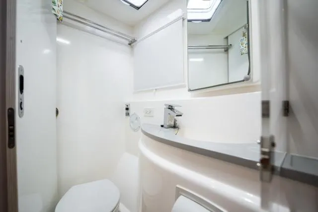 Slide: The Image of Modern bathroom interior on 2017 Leopard 51 Powercat yacht, featuring sleek design and fixtures. - 124