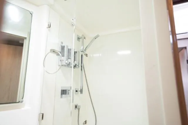 Slide: The Image of Shower area in 2017 Leopard 51 Powercat yacht, featuring modern fixtures and sleek design. - 126