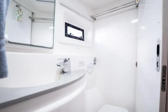 Slide: The Image of Modern bathroom interior on 2017 Leopard 51 Powercat yacht, featuring sleek design and compact amenities. - 128