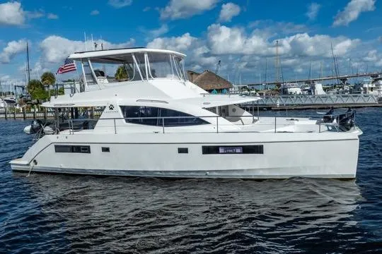 Slide: The Image of 2017 Leopard 51 Powercat yacht docked in marina under blue sky. - 139