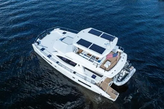 Slide: The Image of 2017 Leopard 51 Powercat yacht with solar panels, cruising on open water. - 143